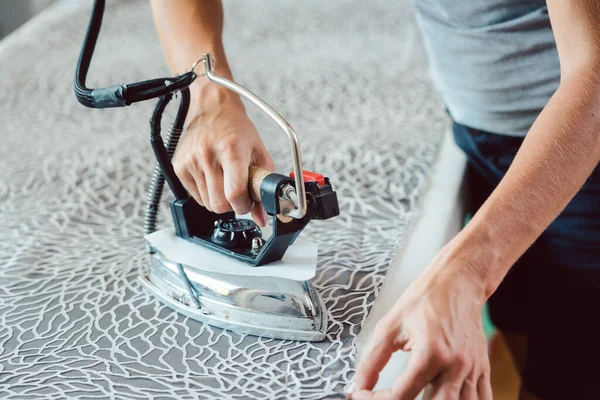 Tailor ironing fabric — Stock Photo, Image