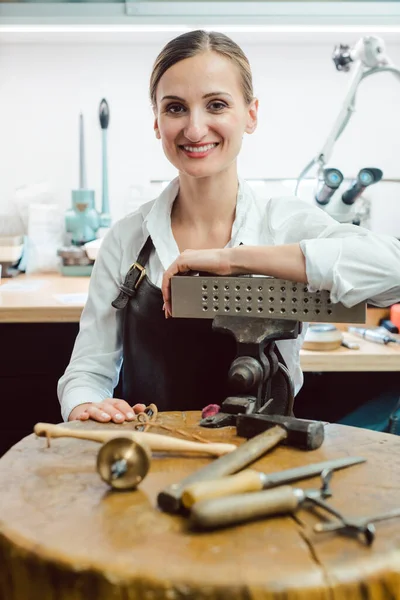 Jewelry designer in her workshop boating with her tools — Stock Photo, Image