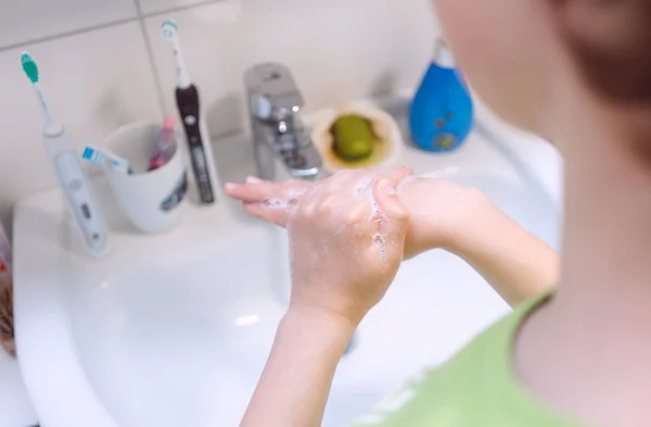 Boy washing his hands thoroughly — Stock Photo, Image