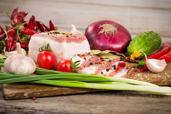 Salted lard with spices and vegetables — Stock Photo, Image