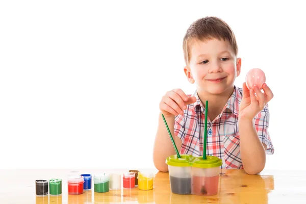 Little kid painting easter eggs with space for text — Stock Photo, Image