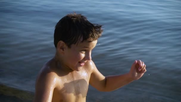 Boy splashing the water to face, slow motion — Stock Video