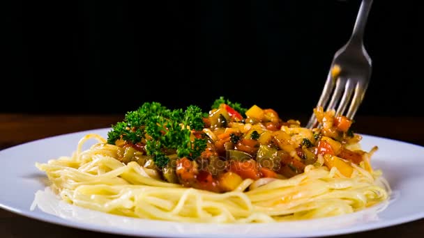 Taking away the fork with pasta and vegetable sauce — Stock Video