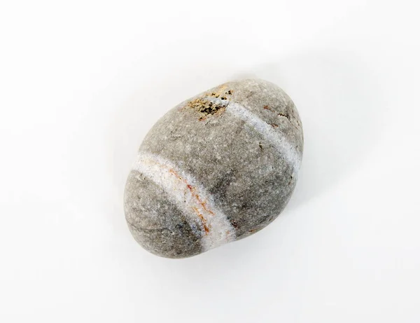 Камень из моря на белом — стоковое фото