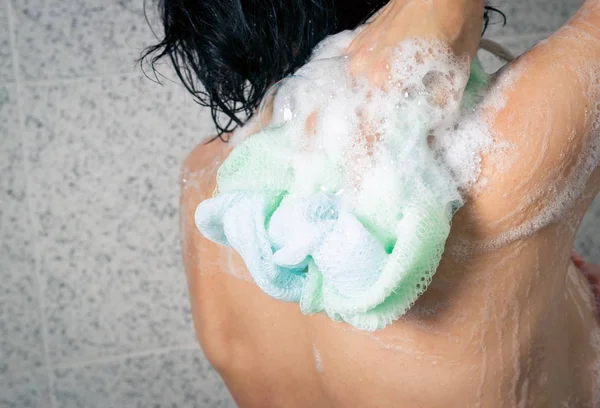 Woman closeup in the home shower — Stockfoto