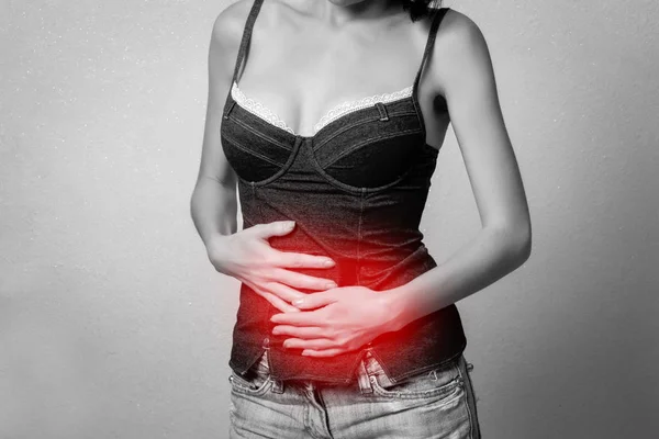 Woman has a stomach pain — Stock Photo, Image