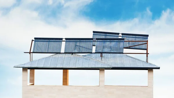 Solar batteries on the house roof — Stock Photo, Image