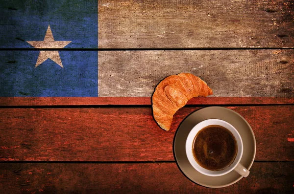 Cup of coffee with croissant and flag — Stock Photo, Image