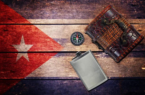 Vintage objects, flask,chest box,compass and flag — Stock Photo, Image