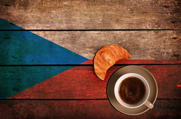 Cup of coffee with croissant and flag — Stock Photo, Image