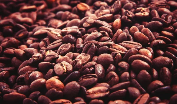 Hintergrund mit den Kaffeebohnen — Stockfoto