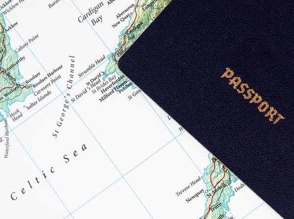 Passport on the open map — Stock Photo, Image