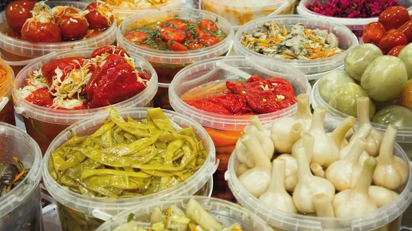 Plastic containers with pickled vegetables. Stock Photo