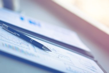 Drawings and charts of successful business, workplace of the businessman