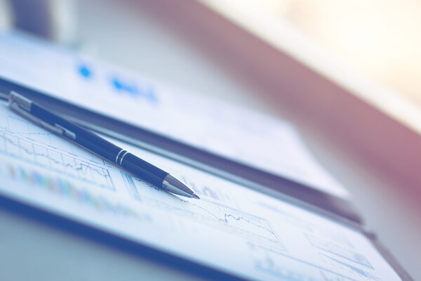 Drawings and charts of successful business, workplace of the businessman