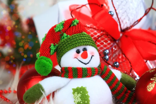 Fabulous snowman on the background of Christmas decorations — Stock Photo, Image