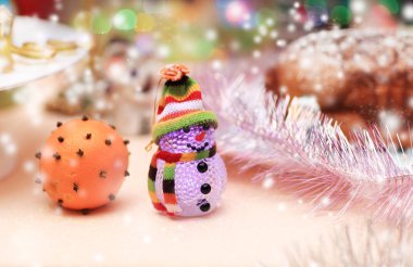 beautiful snowman and festively decorated orange Christmas backg clipart