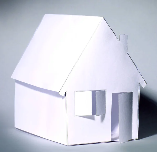 Paper house on a gray background — Stock Photo, Image