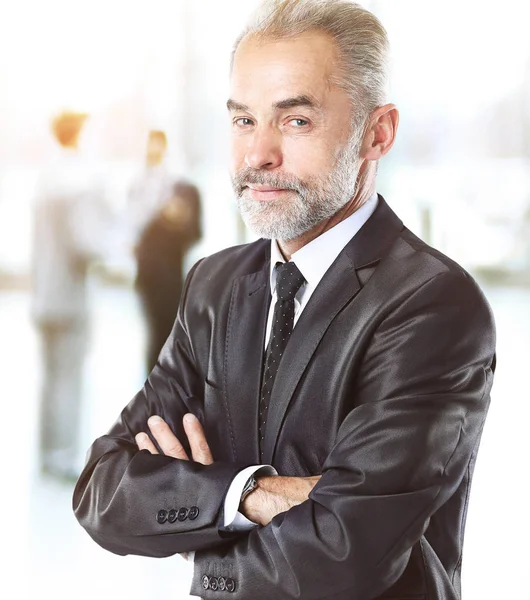 Happy smart business man in vozvraste with teammates in the background — Stock Photo, Image