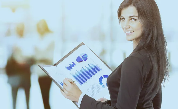 Business woman with charts and diagrams — Stock Photo, Image