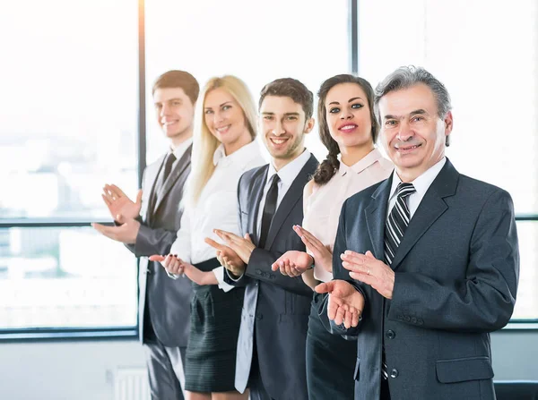 Happy business group applauding the companys success — Stock Photo, Image