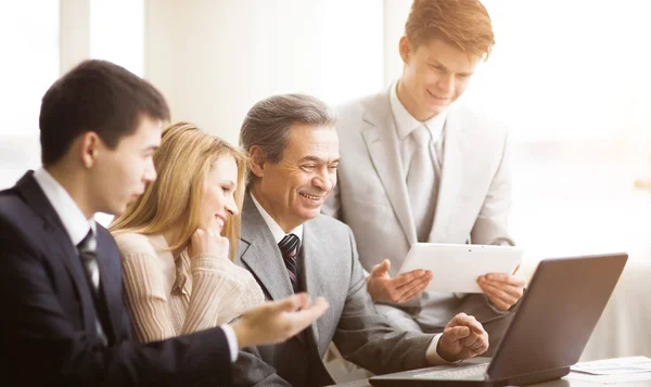 Serious business team with tablet computers, documents having discussion in office — Stock Photo, Image