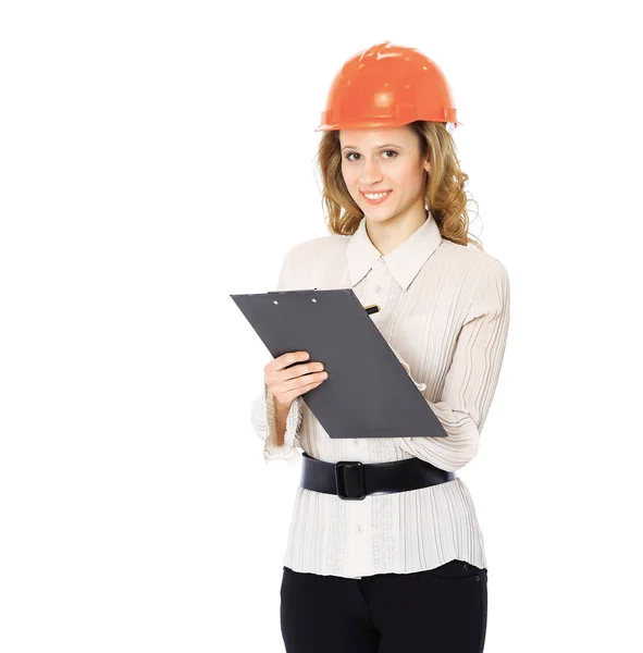 Kvinna ingenjör i en hjälm med en mapp i händerna — Stockfoto