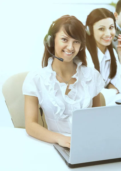 Friendly group of operators sitting at the working place for the laptop. — Stock Photo, Image