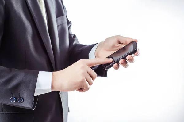 Successful businessman clicks on the smartphone screen. — Stock Photo, Image