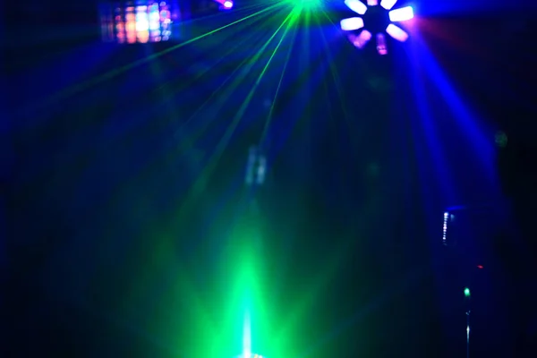 Lighting disco with bright beams of searchlight and laser show. — Stock Photo, Image