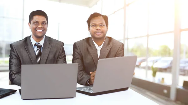 Interracial business team working at laptop in modern office — Stock Photo, Image
