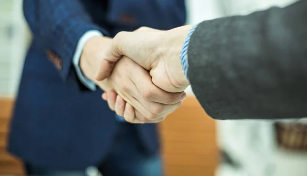 Concept of partnership in business: a handshake of business partners — Stock Photo, Image