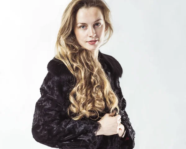 Retrato de una joven mujer de negocios con un abrigo negro sobre un fondo blanco —  Fotos de Stock
