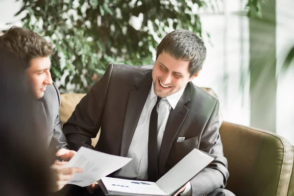 A group of businessmen discussing the policy of the company in the office. — Stock Photo, Image