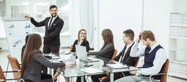 Business team discussing the presentation of a new financial project on a workplace at office — Stock Photo, Image