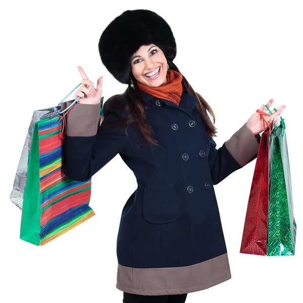 Mujer joven en ropa de invierno con bolsas de compras —  Fotos de Stock