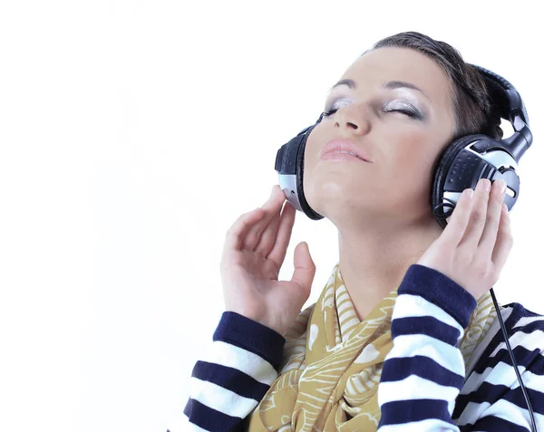 Closeup.beautiful young woman listening to music — Stock Photo, Image