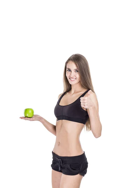 Sağlıklı bir yaşam tarzı kavramı: elinde bir elma ile bir kadın fitness eğitmeni portresi — Stok fotoğraf