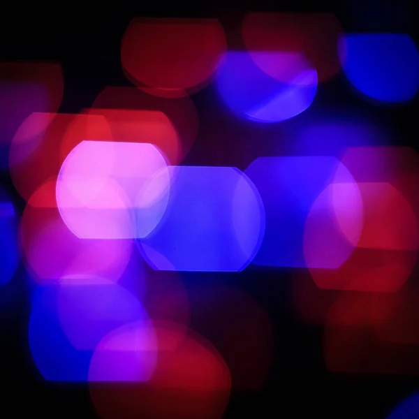 Festive background.blurred colored lights on a black background — Stock Photo, Image