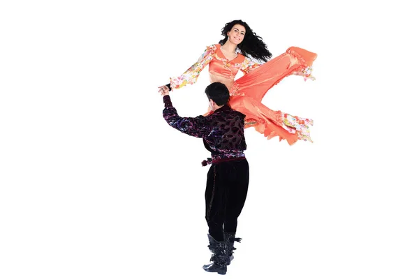 Dancing couple, in the national Gypsy costumes performing folk dance — Stock Photo, Image