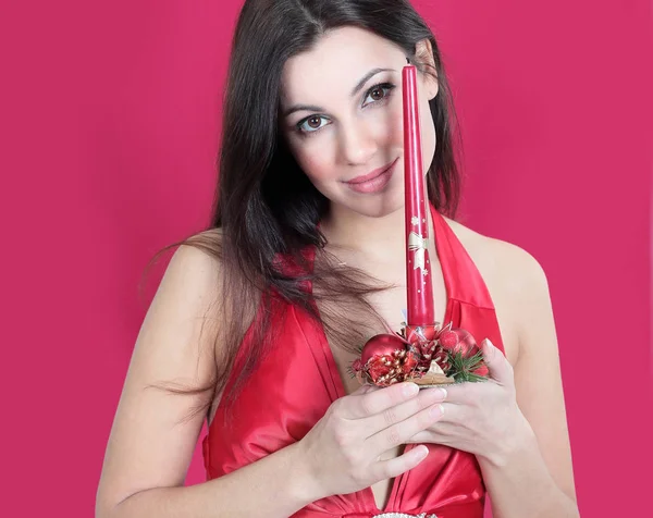 Closeup . a young woman with a Christmas candle — Stock Photo, Image