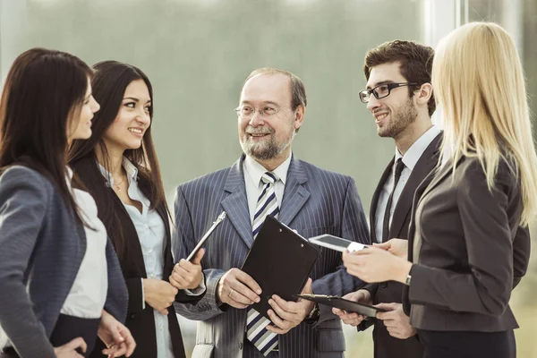 Closeup of the boss and business team on office background — Stock Photo, Image