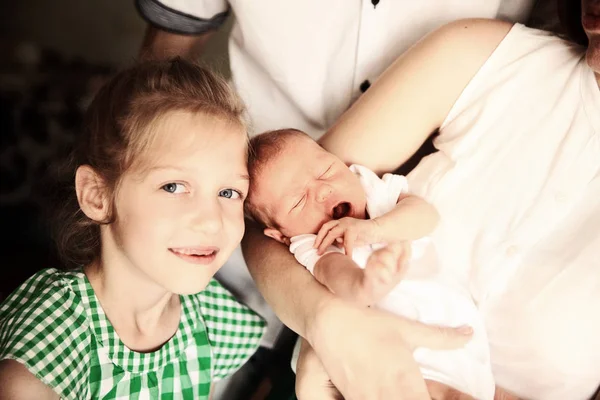 Portrait of big sister with newborn baby — Stock Photo, Image