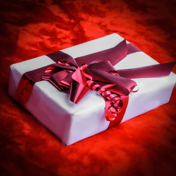 closeup.boxes with gifts with ribbon .isolated on red