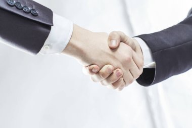 karşılıklı iş ortakları hafif bir arka plan üzerinde.