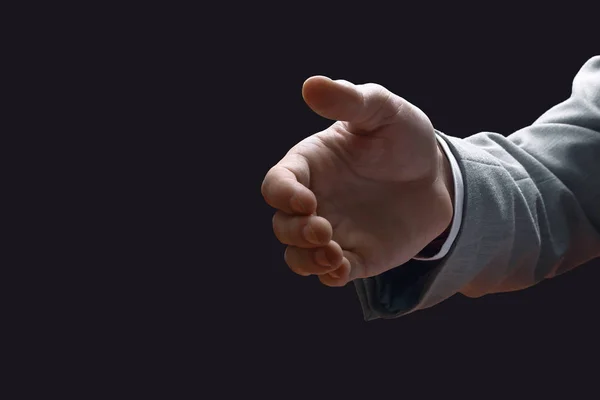 Close-up. zakenman stak hand voor een handdruk tijdens de vergadering op zijn Bureau — Stockfoto