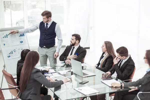 Business team discussing the presentation of a new financial project on a workplace at office — Stock Photo, Image