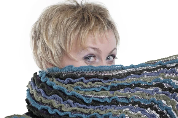 Woman covering her face with a scarf isolated on white background — Stock Photo, Image