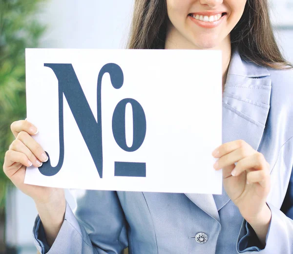 Beautiful business woman in office holding a sign with the number sign — Stock Photo, Image