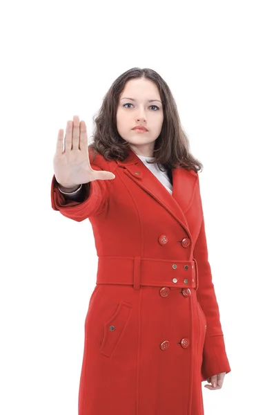 Mooie jonge vrouw in rode jas tonen stopbord weergegeven:. — Stockfoto